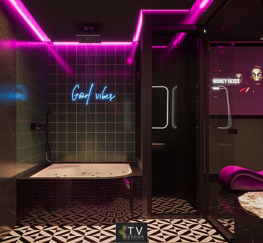 Thiết kế phòng tắm khách sạn chủ đề tình yêu phong cách Neon Glam với ánh sáng hồng tím, bồn tắm hiện đại và dòng chữ phát sáng “Good vibes” – KTV GROUP