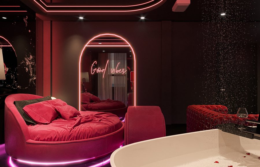 Thiết kế phòng khách sạn tông hồng tím hiện đại, giường tròn và ánh sáng LED tinh tế do KTV Group thực hiện.