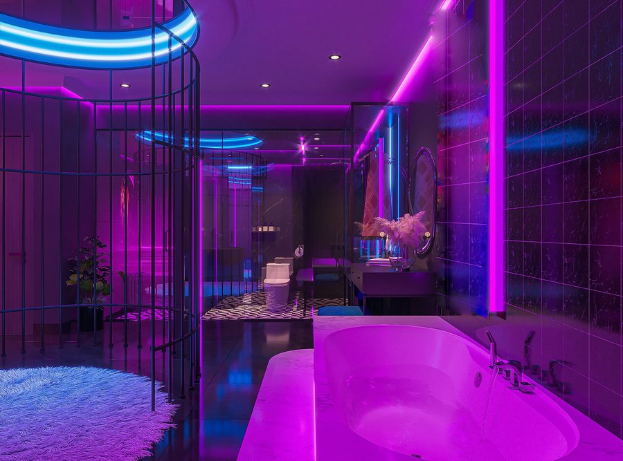 Thiết kế nội thất phòng khách sạn hiện đại với ánh sáng nghệ thuật, giường tròn trung tâm và đèn LED tím – xanh nổi bật, thực hiện bởi KTV GROUP.