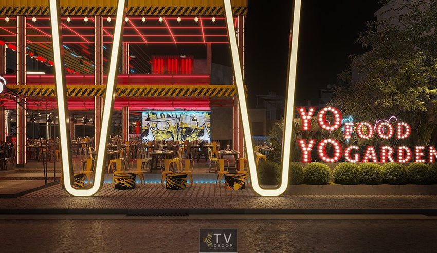 Thiết Kế Thi Công Trọn Gói Beer Club & Beer Garden Chuyên Nghiệp với không gian mở, bàn ghế công nghiệp và ánh sáng nổi bật về đêm