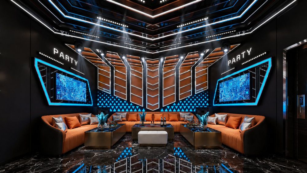 Phòng Karaoke KTV đẹp với trần LED hình học hiện đại Thiết kế phòng karaoke phong cách Futuristic kết hợp ánh sáng xanh Không gian KTV cao cấp với nội thất cam, LED xanh và sàn đá bóng