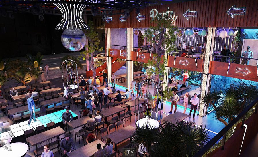 Không gian Beer Garden được tổ chức theo phong cách mở, trần cao, hạn chế vách ngăn nhằm tạo tầm nhìn xuyên suốt giữa các khu vực. Hệ thống bàn dài được bố trí khoa học giúp phục vụ nhóm đông khách, đồng thời tối ưu lối đi và vận hành. Âm thanh và ánh sáng được tính toán đồng bộ với sân khấu DJ trung tâm, mang lại trải nghiệm giải trí liên tục, phù hợp mô hình Beer Garden hoạt động về đêm. 