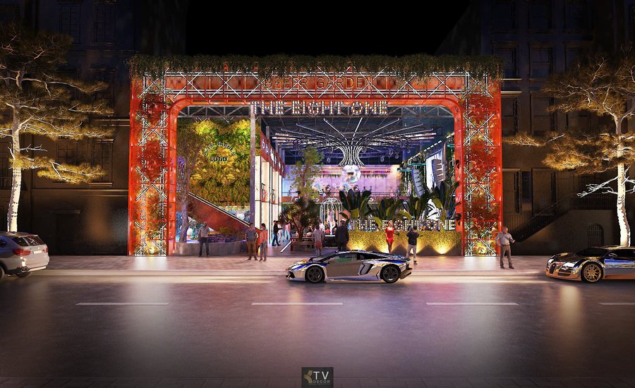 Thiết kế mặt tiền Beer Garden hiện đại với cổng lớn, mảng xanh trang trí, sân khấu DJ trung tâm và không gian giải trí sôi động về đêm do KTV GROUP thực hiện 