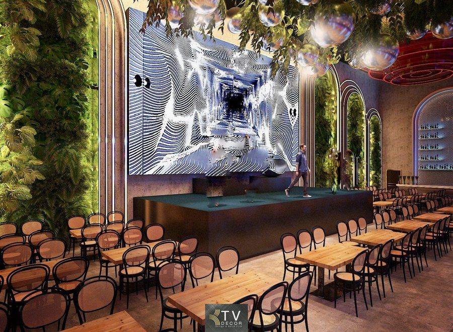 Không gian bên trong Beer Food Garden được tổ chức theo mô hình mở, tận dụng chiều cao trần và chiều sâu công trình. Các dãy bàn gỗ song song tạo cảm giác quy mô, chuyên nghiệp nhưng vẫn gần gũi. Ánh sáng được phân tầng hợp lý, đảm bảo vừa đủ sáng cho ăn uống, vừa tạo không khí giải trí sôi động vào buổi tối. 
