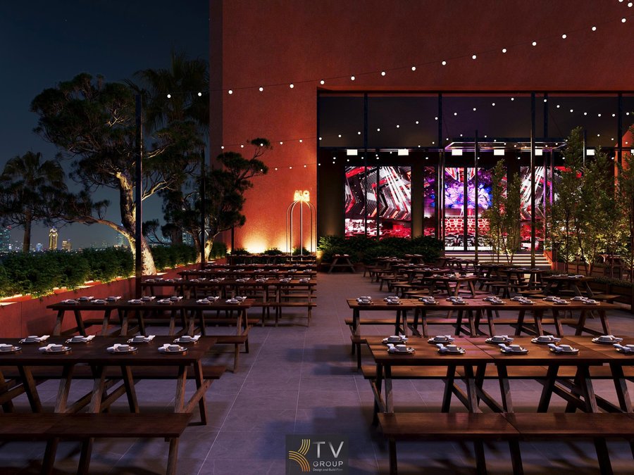 Dự án Thiết Kế Nhà Hàng Beer Garden Phú Quốc – Kiên Giang mang phong cách mở, hiện đại và phóng khoáng. Không gian ngoài trời rộng rãi với bàn ghế gỗ mộc, ánh đèn dây ấm áp tạo cảm giác thư giãn về đêm. Mặt tiền kính kết hợp ánh sáng nghệ thuật giúp kết nối trong–ngoài liền mạch, phù hợp khí hậu biển đảo. Bố cục khoa học tối ưu công năng, lối đi thoáng, dễ tổ chức sự kiện và phục vụ số lượng lớn khách. Thi công trọn gói đảm bảo tiến độ, chất lượng và thẩm mỹ đồng bộ. 