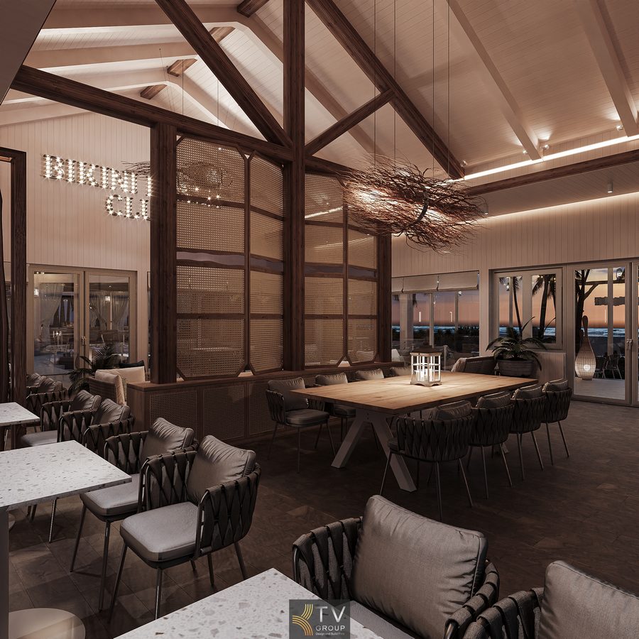 Không gian nhà hàng Beach Restaurant kết hợp cảnh quan cây dừa và ánh sáng đêm, tạo khung cảnh đặc trưng dễ nhận diện thương hiệu. 